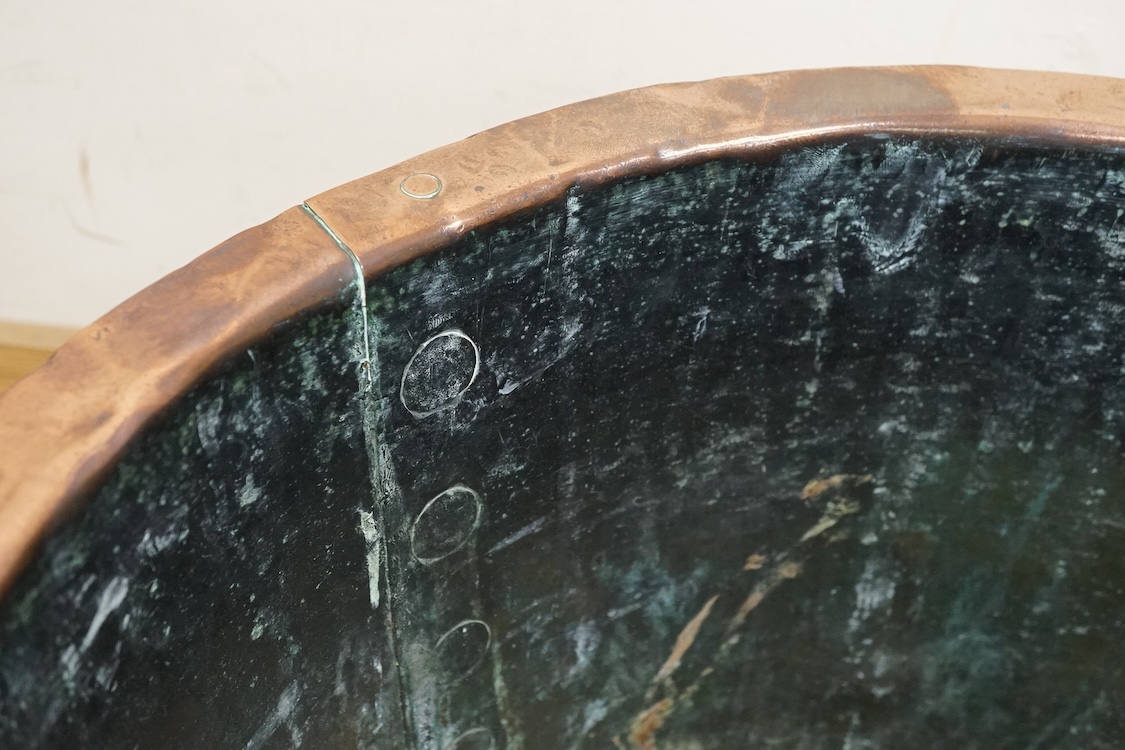 A large riveted copper vat, 34cm high x 51cm diameter.